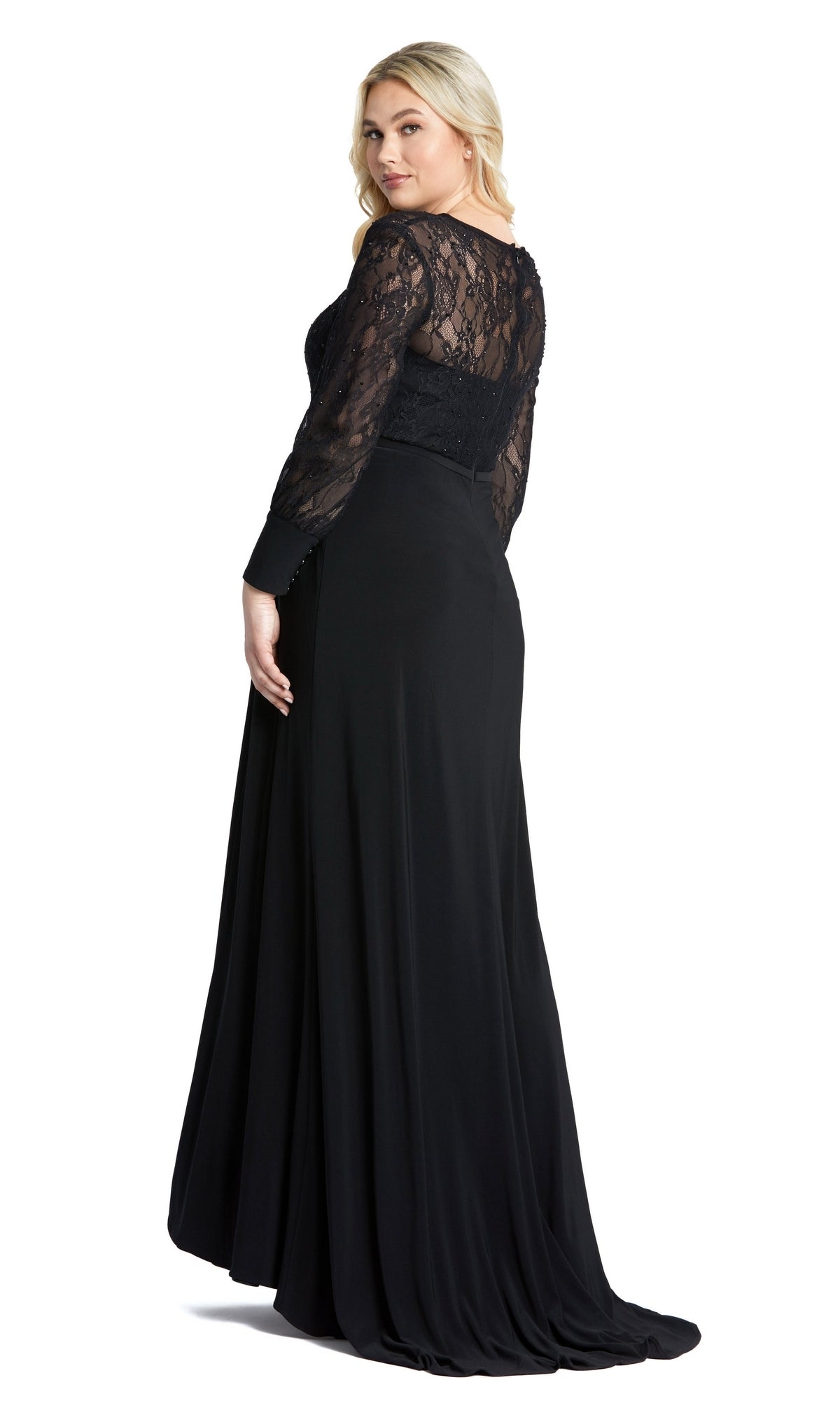 A woman models the Mac Duggal 67143 Plus-Size Black Formal Dress, featuring lace sleeves and a lace back, as she stands facing backward and looks over her shoulder.